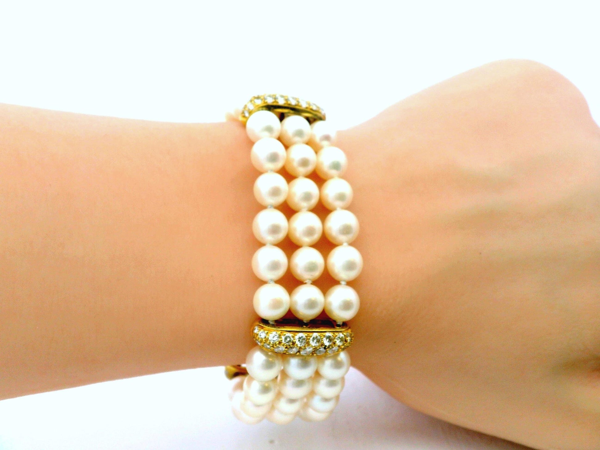 Honora triple strand pearl Bracelet with 4 pave stations 3.28