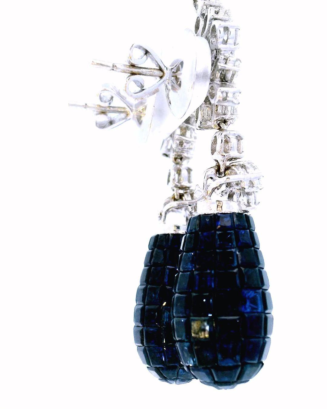 Earrings with invisibly set sapphire drops 12ct total weight and 3.16 tw diamond
