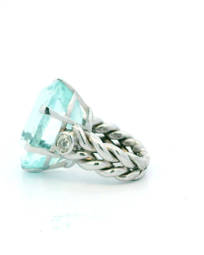 Ring 18kw lg oval 36ct aqua braided shank 2 side dias 1ct tw