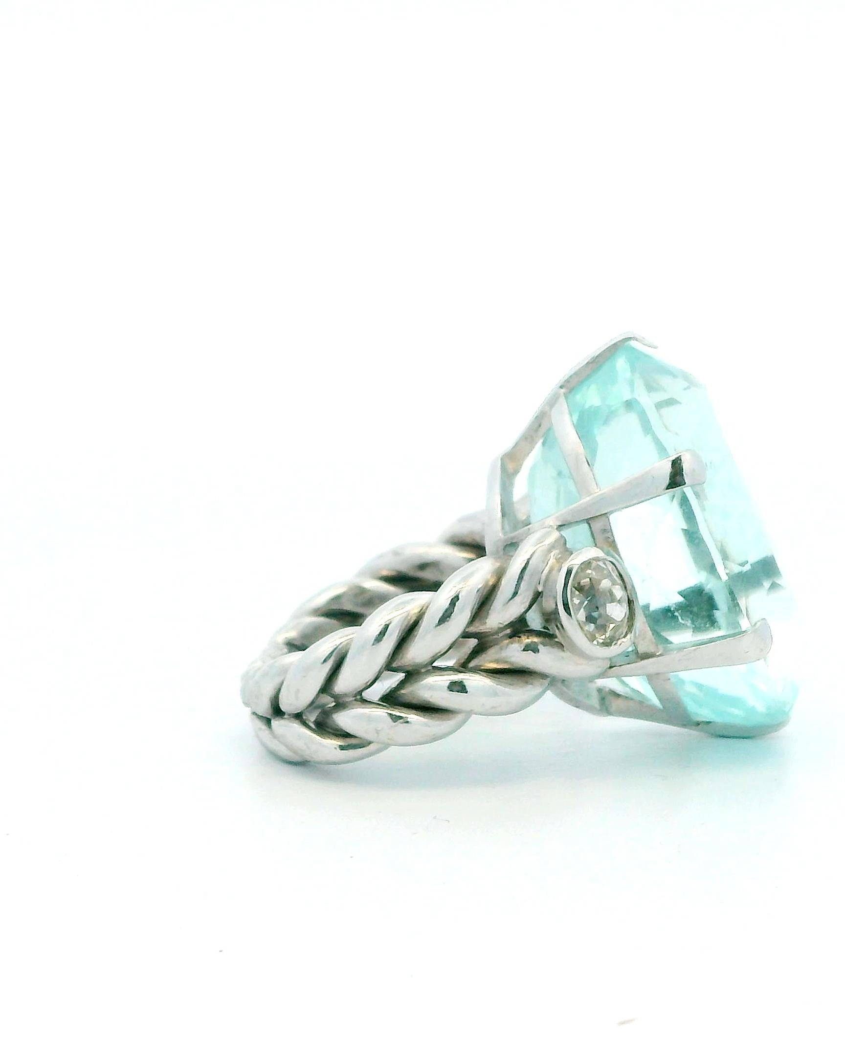 Ring 18kw lg oval 36ct aqua braided shank 2 side dias 1ct tw