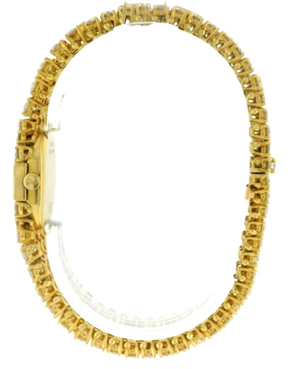 PIAGET. A LADY'S FINE 18K GOLD AND 28Cts DIAMOND-SET OVAL BRACELET WATCH