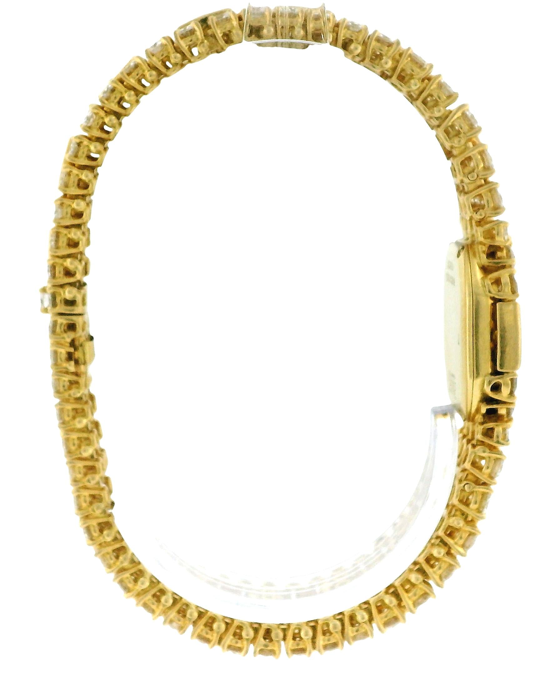PIAGET. A LADY'S FINE 18K GOLD AND 28Cts DIAMOND-SET OVAL BRACELET WATCH