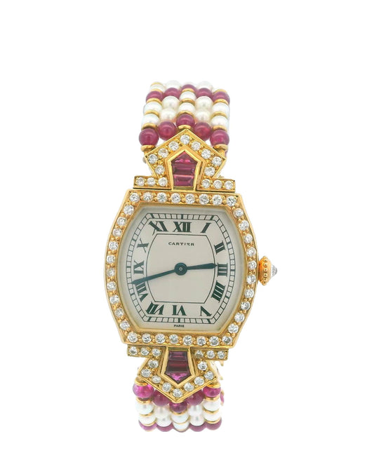 Cartier Tonneau A Rare Lady's Yellow Gold, Ruby, Diamond and Pearl-Set Bracelet