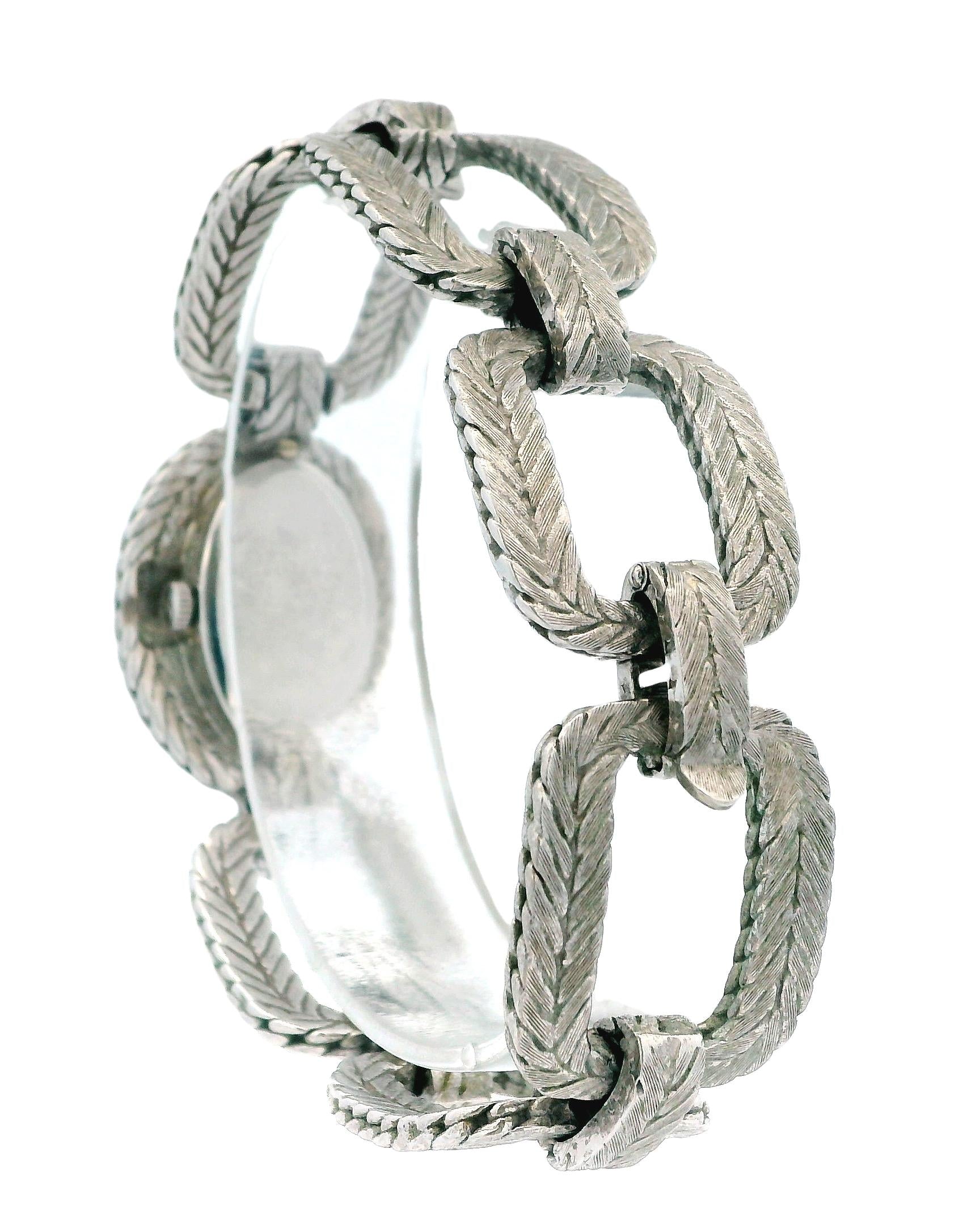 chopard oval lapis dial cush shp herringbone link brac 18kw