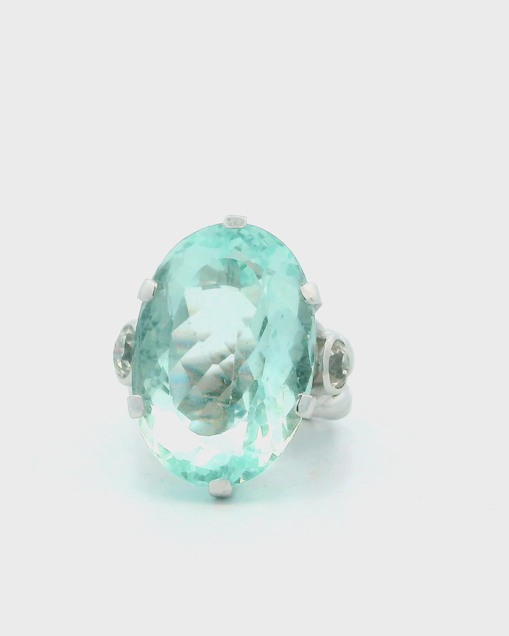 Ring 18kw lg oval 36ct aqua braided shank 2 side dias 1ct tw