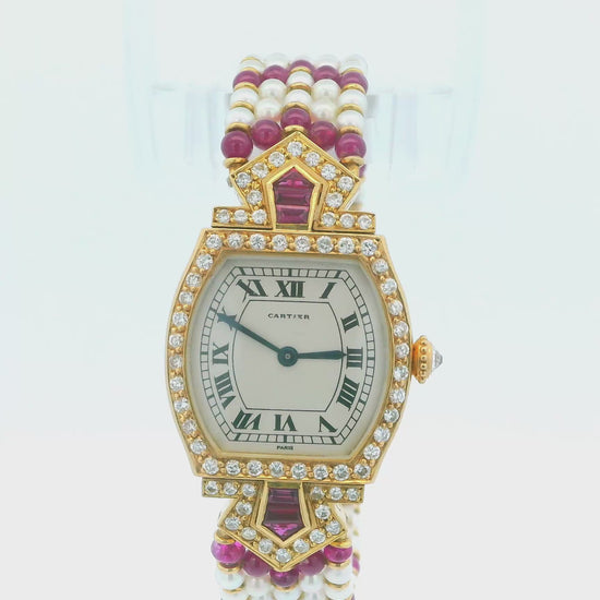 Cartier Tonneau A Rare Lady's Yellow Gold, Ruby, Diamond and Pearl-Set Bracelet